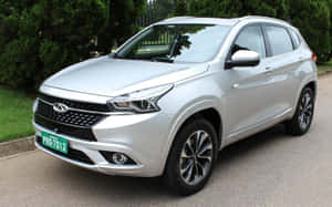 Sleek And Stylish Chery Car In Action Wallpaper