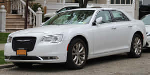 Sleek And Stylish Chrysler 300 In Motion Wallpaper