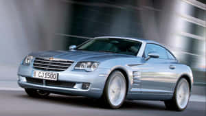 Sleek And Stylish Chrysler Crossfire On The Road Wallpaper