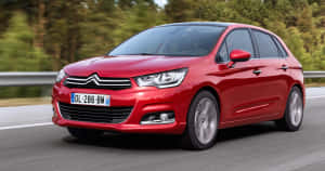 Sleek And Stylish Citroen C4 In Action Wallpaper