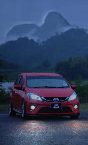 Sleek And Stylish Daihatsu On The Open Road Wallpaper