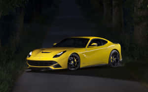 Sleek And Stylish Ferrari F12 Berlinetta On The Open Road Wallpaper