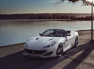 Sleek And Stylish Ferrari Portofino Cruising The Open Road Wallpaper