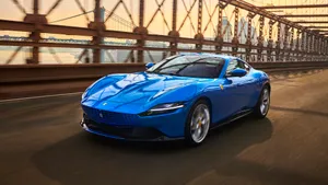 Sleek And Stylish Ferrari Roma On The Road Wallpaper