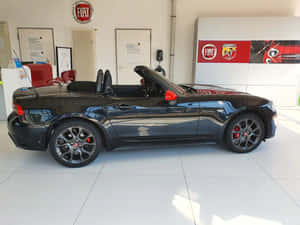 Sleek And Stylish Fiat 124 Spider Wallpaper