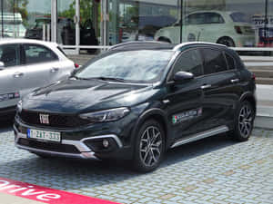 Sleek And Stylish Fiat Tipo On The Road Wallpaper