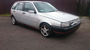 Sleek And Stylish Fiat Tipo On The Road Wallpaper