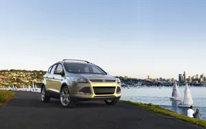 Sleek And Stylish Ford Escape On The Road Wallpaper