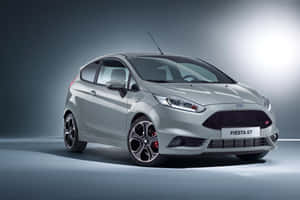 Sleek And Stylish Ford Fiesta On The Road Wallpaper