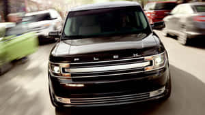 Sleek And Stylish Ford Flex On The Road Wallpaper