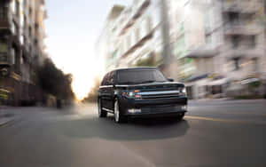 Sleek And Stylish Ford Flex On The Road Wallpaper