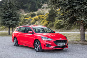 Sleek And Stylish Ford Focus On An Open Road Wallpaper