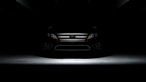 Sleek And Stylish Ford Fusion On The Open Road Wallpaper