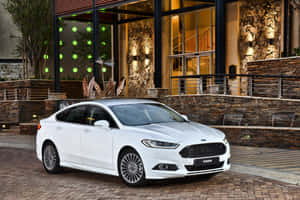 Sleek And Stylish Ford Fusion On The Road Wallpaper