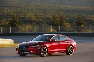 Sleek And Stylish Genesis G70 In Action Wallpaper