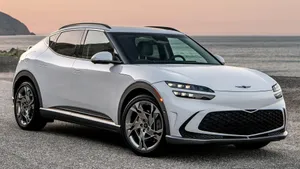 Sleek And Stylish Genesis Gv60 On The Open Road Wallpaper