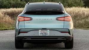 Sleek And Stylish Genesis Gv60 On The Road Wallpaper