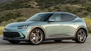 Sleek And Stylish Genesis Gv60 On The Road Wallpaper