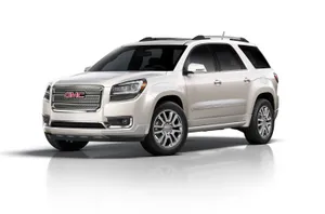 Sleek And Stylish Gmc Acadia On The Road Wallpaper