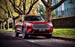 Sleek And Stylish Haval Suv On A Scenic Drive Wallpaper