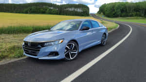 Sleek And Stylish Honda Accord In Motion Wallpaper