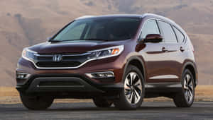 Sleek And Stylish Honda Cr-v On The Road Wallpaper