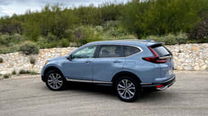 Sleek And Stylish Honda Cr-v On The Road Wallpaper