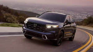 Sleek And Stylish Honda Cr-v On The Road Wallpaper