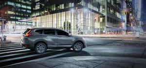 Sleek And Stylish Honda Cr-v On The Road Wallpaper