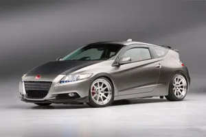 Sleek And Stylish Honda Cr-z In A Cityscape Wallpaper