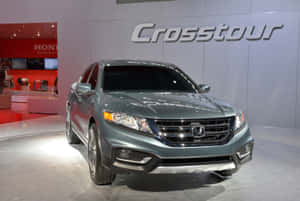 Sleek And Stylish Honda Crosstour On A Scenic Road Wallpaper