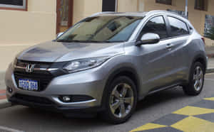 Sleek And Stylish Honda Hr-v On Scenic Road Wallpaper