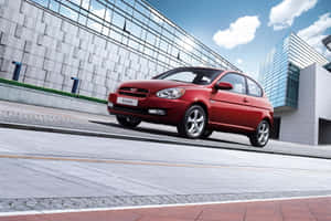 Sleek And Stylish Hyundai Accent In A Majestic Setting Wallpaper