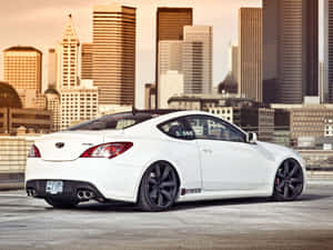 Sleek And Stylish Hyundai Genesis In Motion Wallpaper