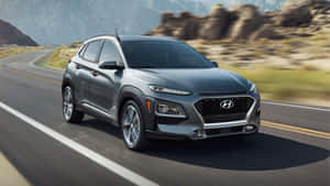 Sleek And Stylish Hyundai Kona On The Road Wallpaper