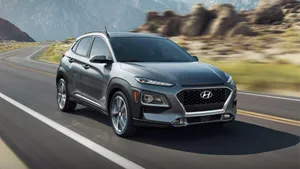 Sleek And Stylish Hyundai Kona On The Road Wallpaper