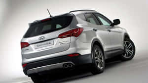 Sleek And Stylish Hyundai Santa Fe On Open Road Wallpaper