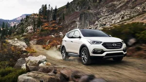 Sleek And Stylish Hyundai Santa Fe On The Road Wallpaper