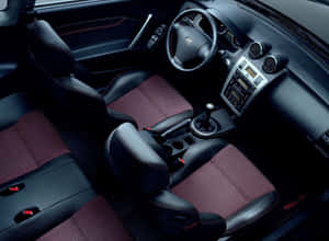 Sleek And Stylish Hyundai Tiburon On The Road Wallpaper