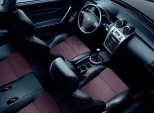 Sleek And Stylish Hyundai Tiburon On The Road Wallpaper