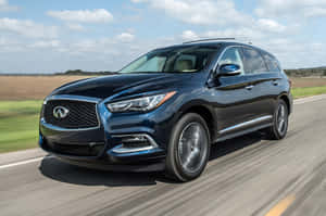 Sleek And Stylish Infiniti Qx60 On Scenic Road Wallpaper