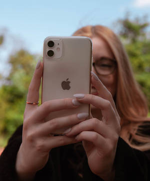 Sleek And Stylish Iphone 11 In A Vibrant Red Color Wallpaper