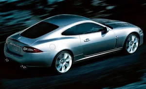 Sleek And Stylish Jaguar Xkr In Motion Wallpaper