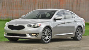 Sleek And Stylish Kia Cadenza Cruising Wallpaper