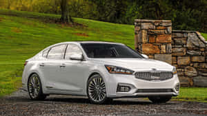 Sleek And Stylish Kia Cadenza On The Road Wallpaper