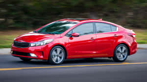 Sleek And Stylish Kia Forte Parked Outdoor Wallpaper