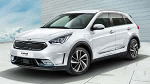 Sleek And Stylish Kia Niro On Road Wallpaper