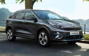 Sleek And Stylish Kia Niro On The Road Wallpaper