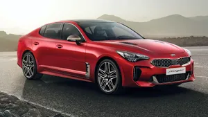 Sleek And Stylish Kia Stinger In Action Wallpaper