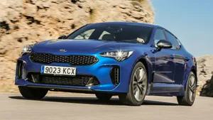 Sleek And Stylish Kia Stinger On The Road Wallpaper